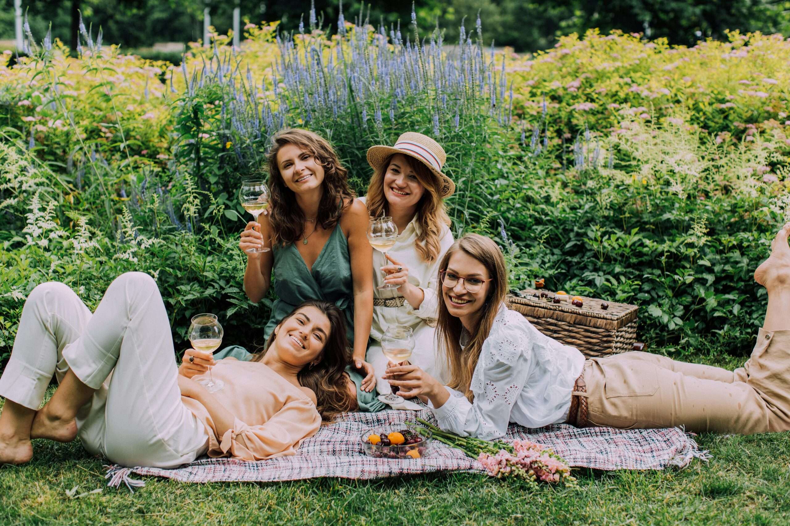 Image Source: Photo by Elina Fairytale: https://www.pexels.com/photo/women-sitting-on-a-picnic-blanket-holding-glass-of-wine-while-smiling-at-the-camera-4833963/